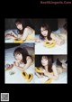 A woman laying on a bed eating a papaya.