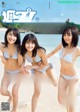 A group of three women in bikinis on a magazine cover.