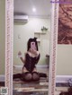 A woman taking a selfie in a mirror.
